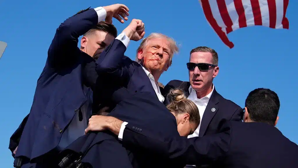 former President Trump is surrounded by U.S. Secret Service agents