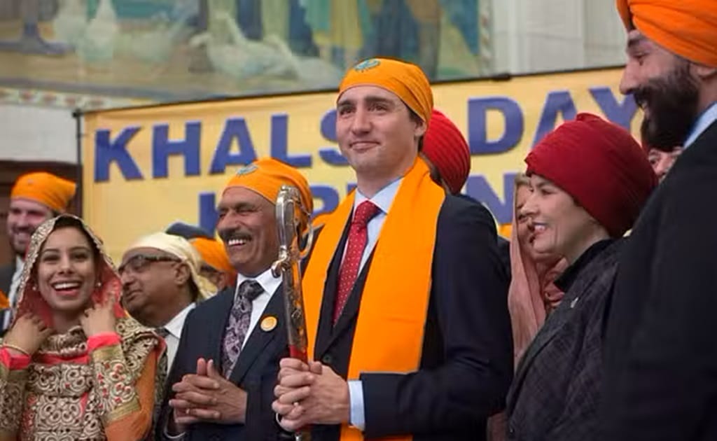 Prime Minister Justin Trudeau with members of the Sikh Caucus.