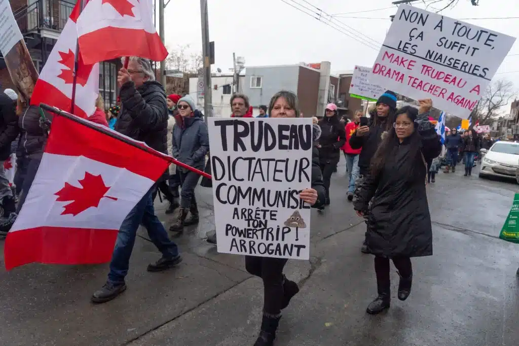 Protesters against COVID-19 restrictions march through the streets of Montreal