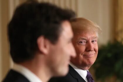 President Donald Trump smiles at Canadian Prime Minister Justin Trudeau